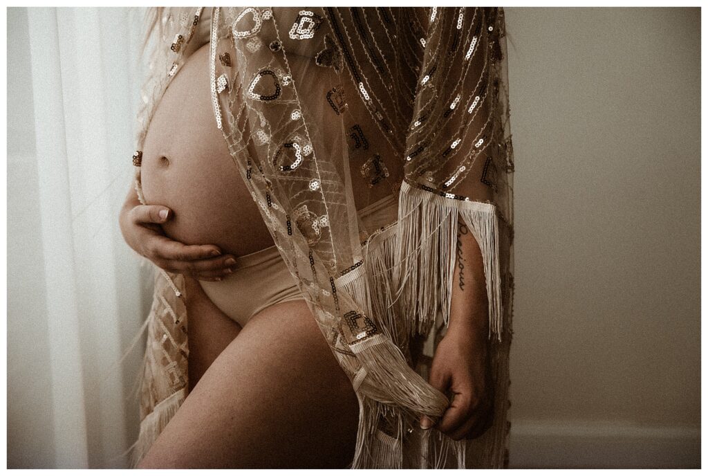 close up of belly with sequin robe luxury fine art maternity session St Louis Missouri