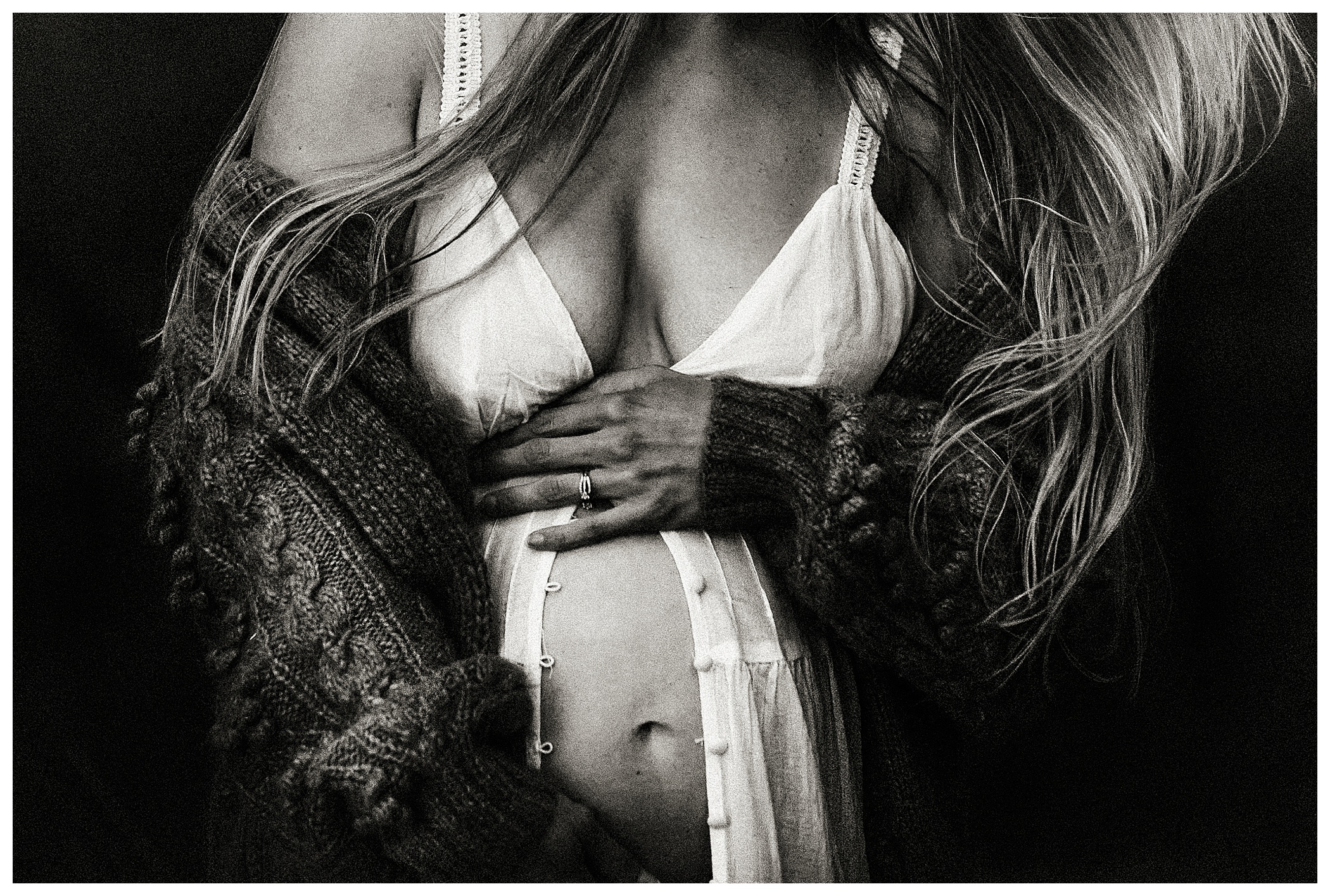 black and white close up maternity session artistic wild and moody pregnant woman holding her belly at outdoor maternity session O'fallon Missouri fine art photographer