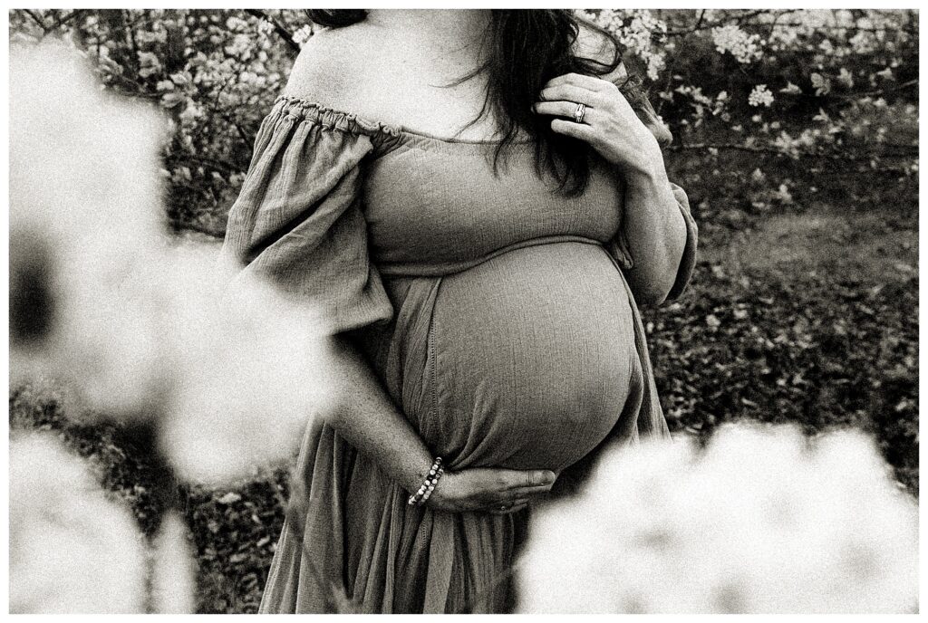 black and white close up of expecting mother during maternity session in Missouri blooms