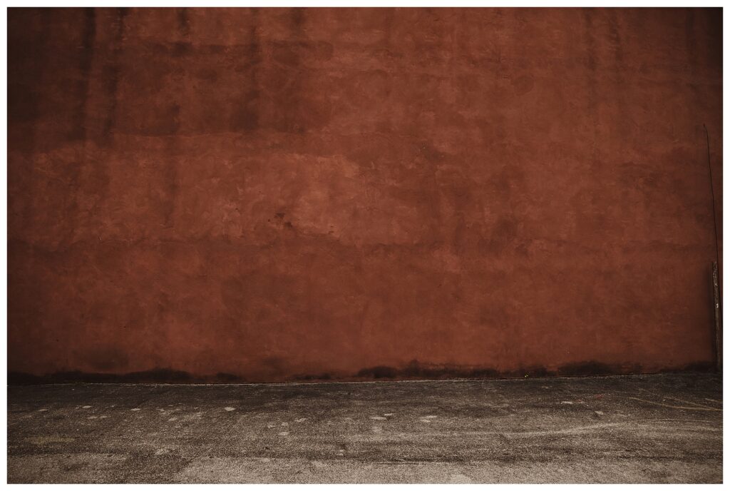 terracotta wall at Soulard best kept secret engagement session spots STL Missouri wedding photographer