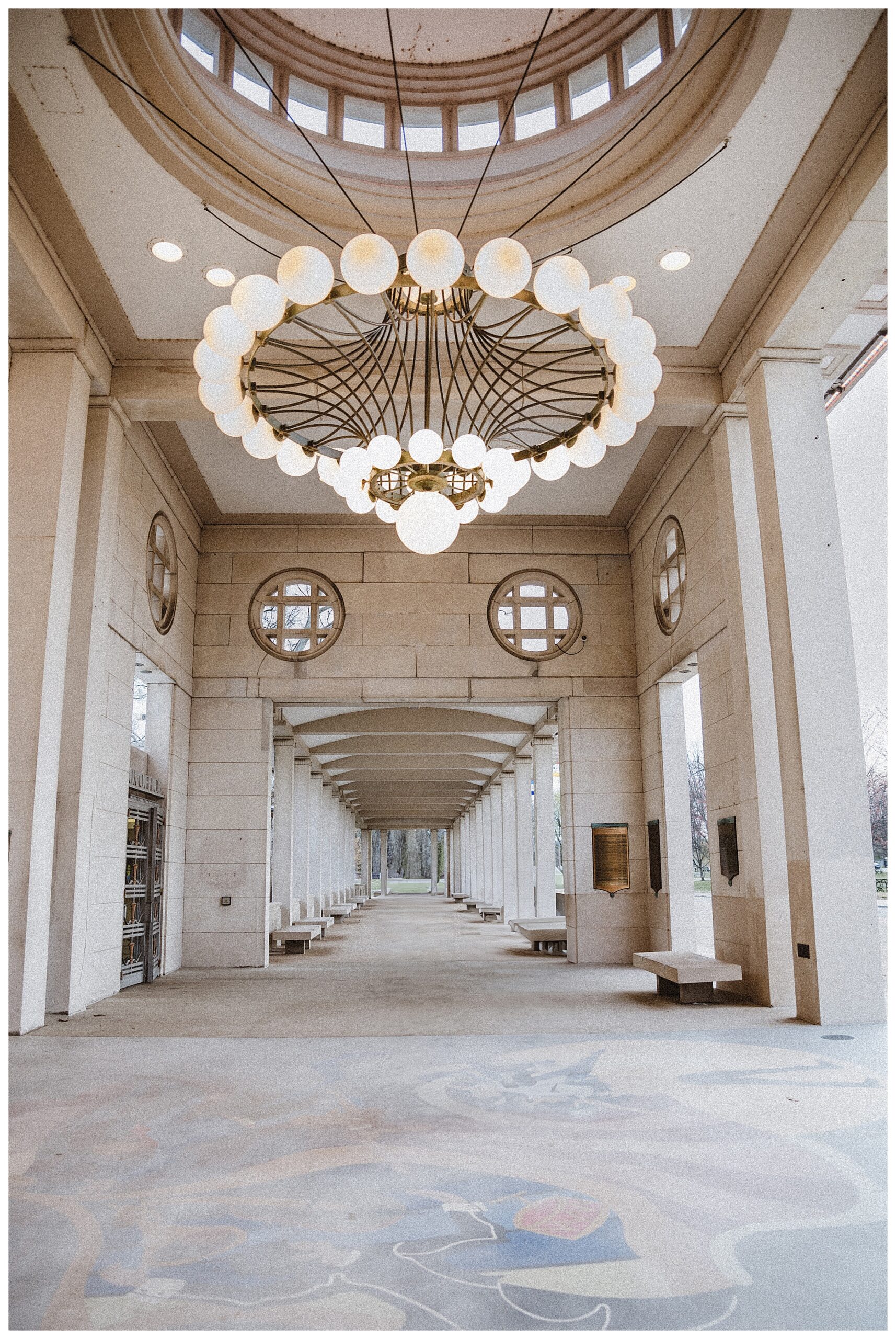 The Muny St Louis most popular engagement session spot STL wedding photographer place with big chandelier