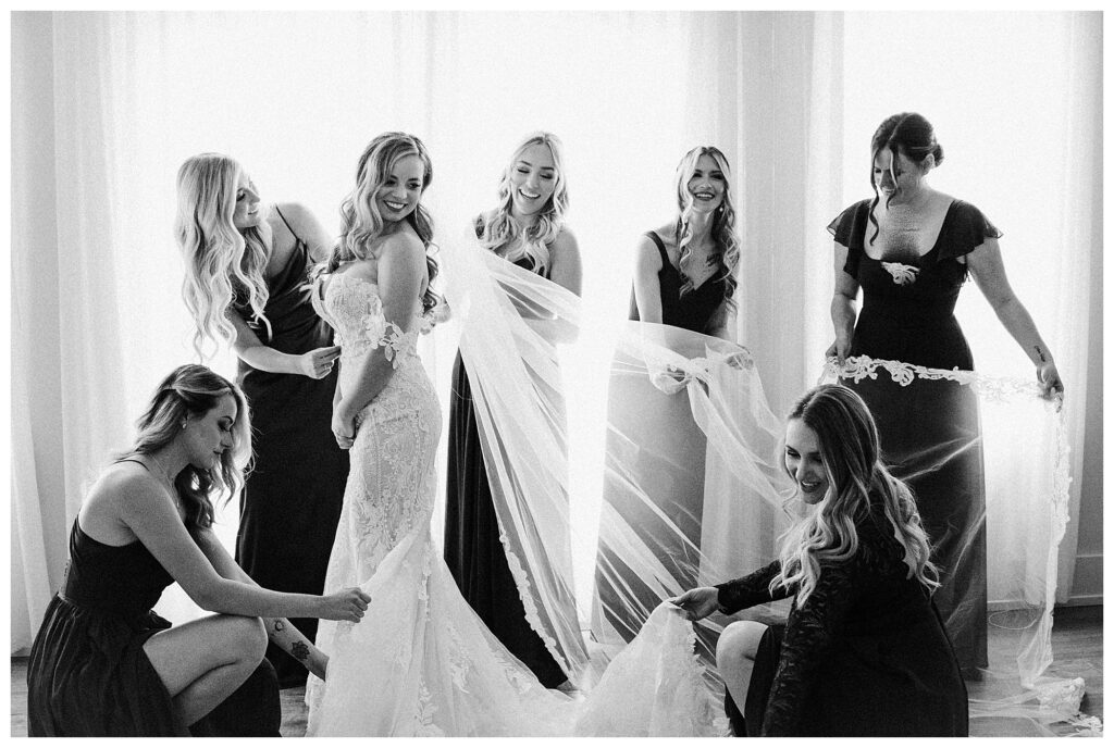 black and white bride and bridesmaids in bridal suite