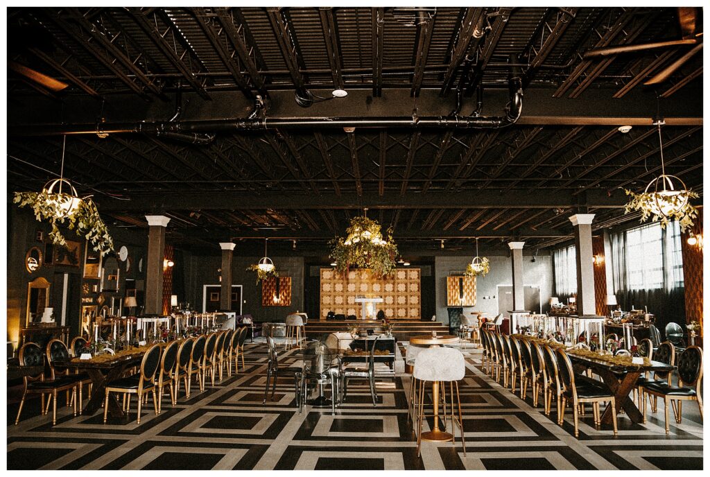 reception space black and gold moody, unique, quirky, full of character in St. Louis Missouri wedding photographer