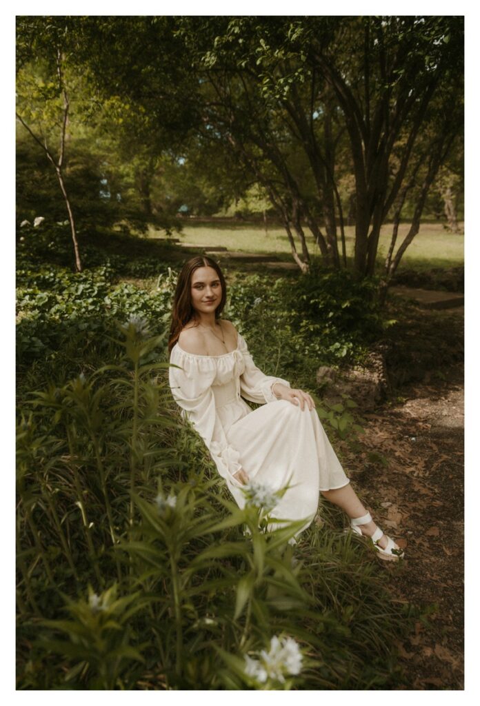 bride sitting in flowers green tinted romantic portrait at Lafayette Park