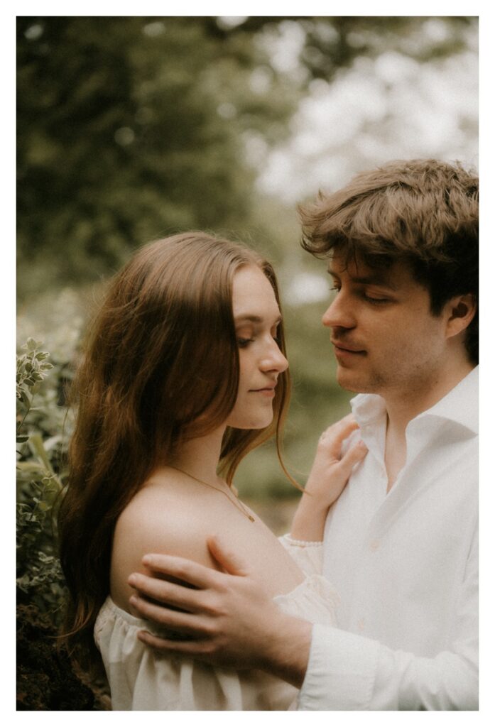 romance novel inspired engagement session gentle touch on shoulder bride and groom
