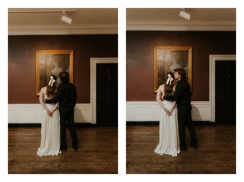Couple looking at painting at Museum engagement session in St. Louis